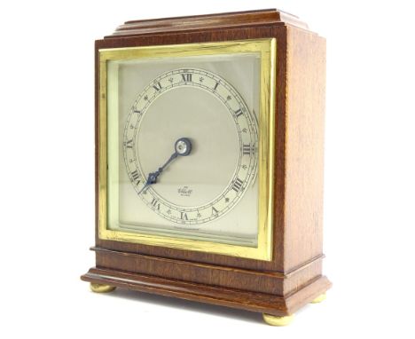 An Elliott mantel timepiece, with silvered dial and chapter ring, stamped French escapement, bevel glass, the mahogany case m