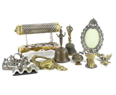 A collection of metalware, an Indian silvered metal and brass scroll holder, various other metalware, to include a hand shape