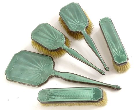 An Asprey Art Deco silver part dressing table set, with green guilloche enamel decoration to each back, comprising hand mirro