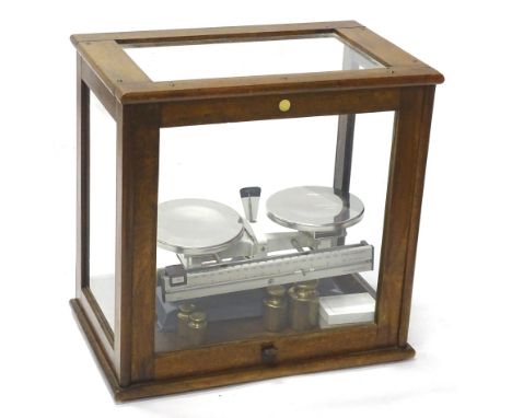 A set of Griffin scales, with brass weights in associated mahogany and glazed laboratory scales case, 46cm wide.