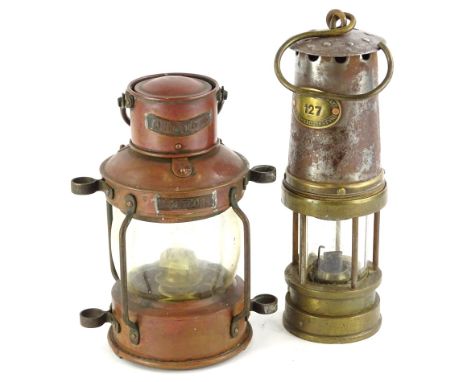 A Patterson brass and steel miners lamp, numbered 127 and a small copper Meteor anchor ships lamp (2).