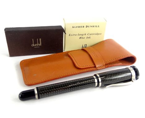 An Alfred Dunhill grey carbon fibre fountain pen, with brushed metal mounts signed to the hinged clip, and two packs of Dunhi