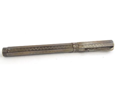 A silver Montegrappa fountain pen, with an engine turned Greek key design overall, the nib stamped 750, and with Greek key em