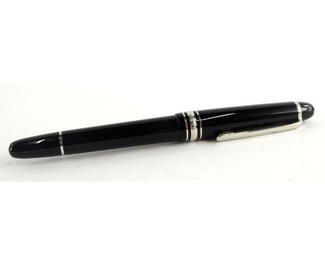 A Montblanc Meisterstuck black and silver fountain pen, the nib stamped AU 585.