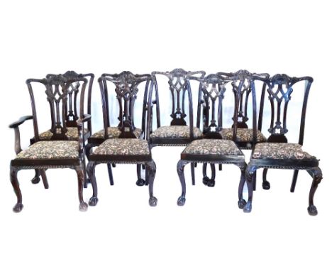 An early 20thC mahogany extending dining table, the oval top with a moulded edge with a gadrooned frieze on cabriole legs wit