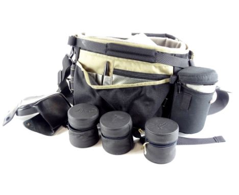 A Low Pro camera bag, and three Leica lens cases, a Leica flash gun in original box and various Hoya filter diffusers.