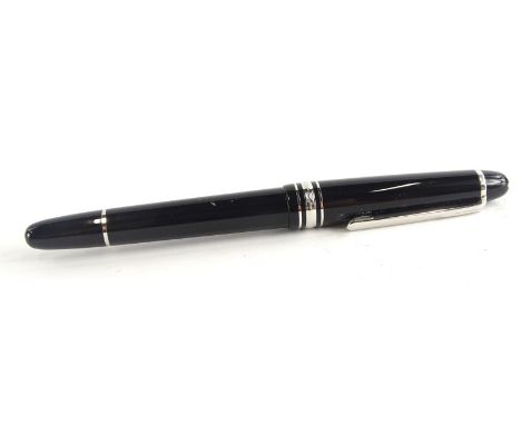 A Montblanc black and silver fountain pen, the nib stamped 585, personalised initials to cap.