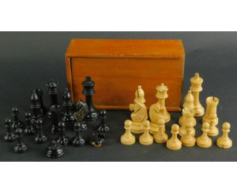 A small sycamore and ebonised chess set, unmarked and boxed. 