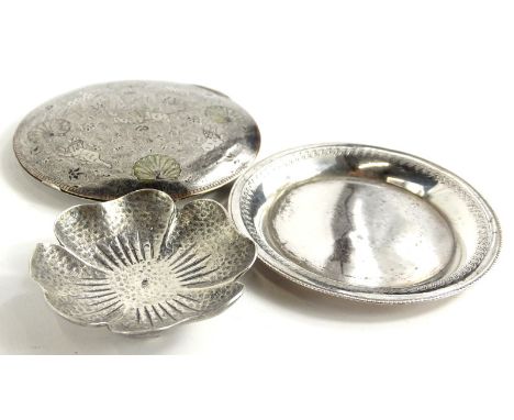 Three continental silver coloured metal items, to include a pansy shaped bowl with hammered decoration, a plated pin tray, an