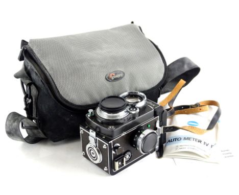 A Rolleiflex 2.8 FX reflex camera, with original box, etc.
