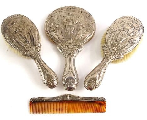 An early 20thC associated silver mounted dressing table set, each piece with a design of an Art Nouveau style lady holding a 