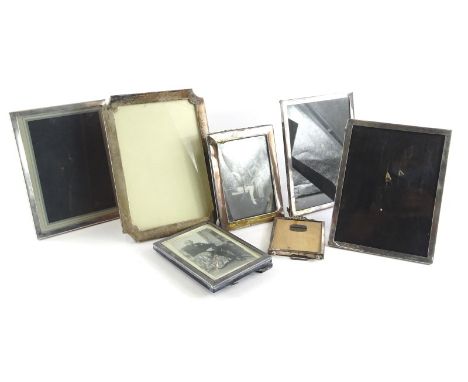 A collection of silver and silver plate mounted photograph frames, of differing decoration, to include a near set of three si
