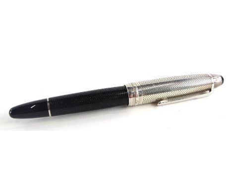 A Montblanc Meisterstuck Pix fountain pen, with engraved decoration to the black base, the top with similar decoration, possi