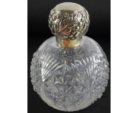 A Victorian cut glass globular scent bottle, with silver mount, embossed with leaves, beads, etc., inner glass stopper, mount