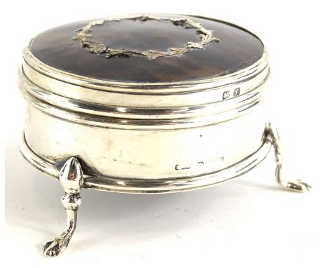 An early 20thC silver and tortoiseshell trinket box, the hinged circular lid with piquet decoration of laurel leaves, marks i