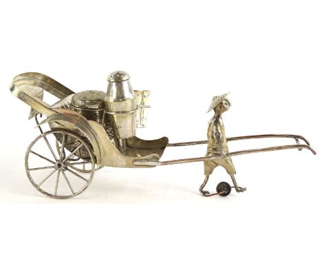 An eastern silver plated cruet, modelled in the form of a rickshaw, with spoked wheels, containing a salt, simulated basket c