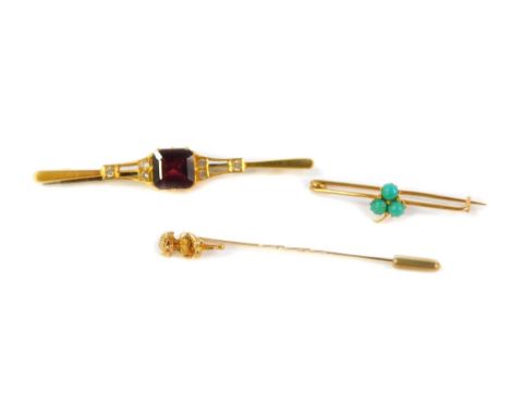 Two bar brooches and a Lincoln Imp stick pin, being one set with three turquoise stones and an Edwardian example set with red