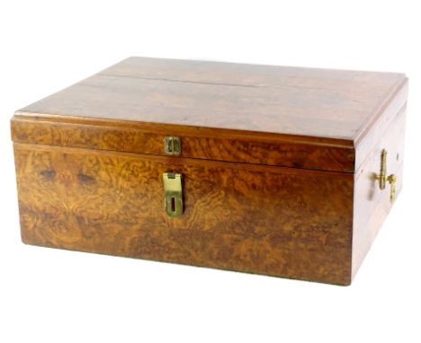 A continental rectangular burr walnut box, the hinged lid enclosing a vacant interior, with later adapted side handles, possi