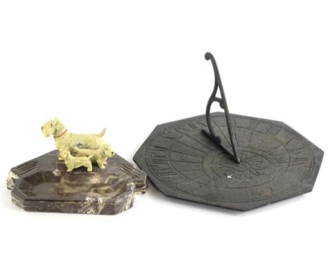 An Art Deco marble desk stand, set with three spelter dogs, 18cm wide and a sundial, bearing the date 1659, of octagonal form