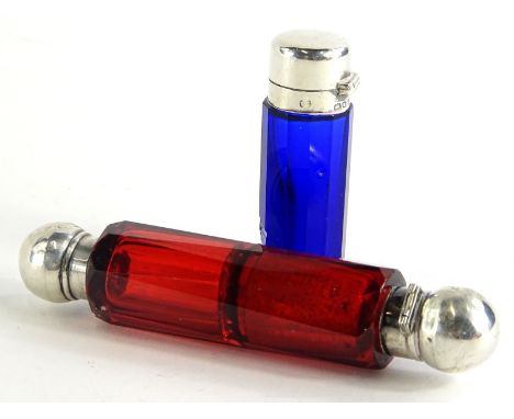 A continental Bohemian type double ended ruby tinted scent bottle, with silver coloured metal mounts to each end, and a blue 