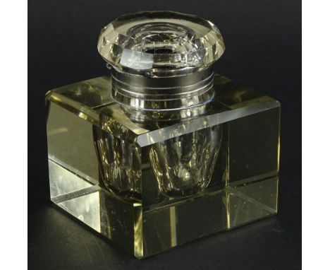 A large square Edwardian faceted glass inkwell, with silver plated mounts, 10cm wide.