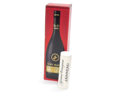 A bottle of Remy Martin Champagne Cognac, boxed, and a miniature bottle of Janneau Grand Armagnac, boxed.
