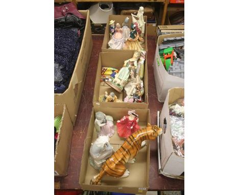 Three boxes of Doulton, Lladro etc.