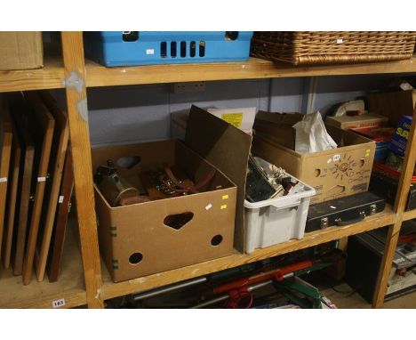 Shelf of four boxes, including lamps, scales, etc.