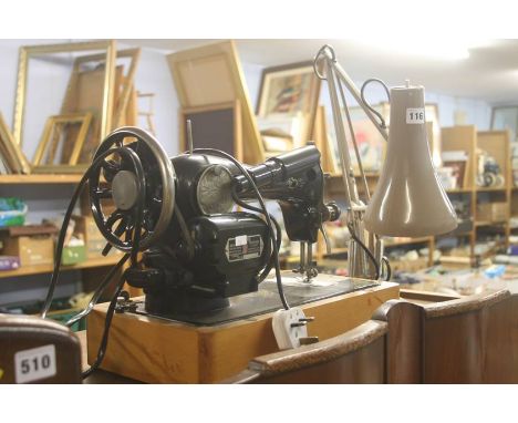 A Singer sewing machine and angle poise lamp