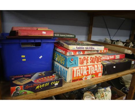 Shelf of boxed games etc.
