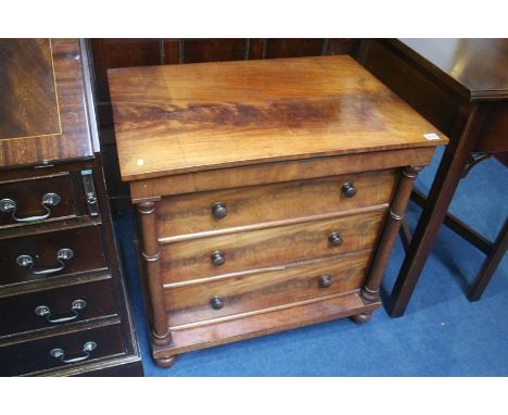 A Victorian commode in the form of a chest of drawers, 73cm wide