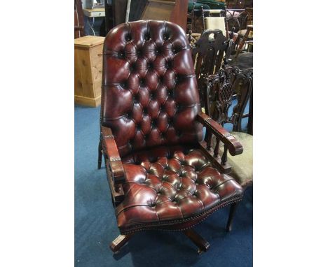 A burgundy leather button back Chesterfield office chair