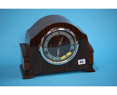 A walnut cased mantle clock