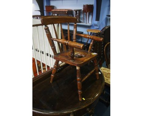 A child's commode chair