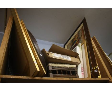 Shelf of pictures, mirror etc.