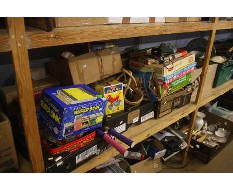 Shelf of various board games, toys etc.
