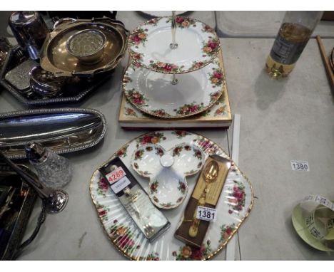 Royal Albert two tier cake stand, boxed, with a tray, tri-lobed dish, fork and spoon, all in the Old Country Roses pattern. U