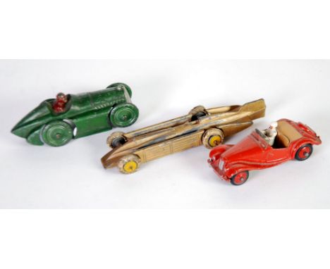 TAYLOR & BARRETT CIRCA 1930s DIE CAST MODEL OF A RACING CAR with open base, cast in brown driver, silver painted chevron radi