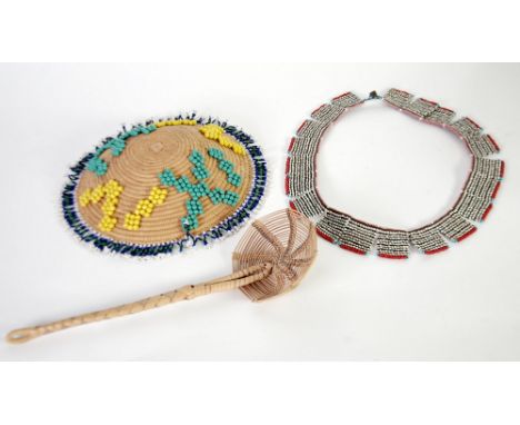 PROBABLY FAR EASTERN BEADWORK NECKLACE, consisting of twenty oblong panels worked in white, black and green and bordered in r