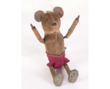 EARLY TWENTIETH CENTURY PROBABLY GERMAN TINPLATE AND VELVET FABRIC CLOCKWORK STANDING MOUSE, depicted in red shorts and havin