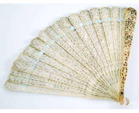 LATE NINETEENTH CENTURY CARVED AND FINELY PIERCED ORIENTAL IVORY BRISE FAN, the outer sticks carved in bas relief with figure