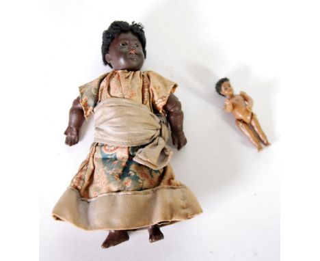 EARLY TWENTIETH CENTURY PROBABLY GERMAN SMALL BISQUE SWIVEL HEADED NEGRO WOMAN DOLL AND BABY, the back of the womans neck num