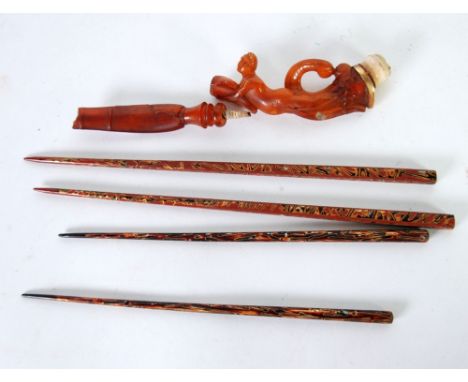 AGED FIGURAL CARVED AMBER TWO PIECE OPIUM PIPE, modelled as a naked female figure, with gilt metal collar and meerschaum bowl