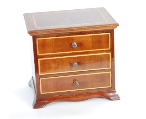 REPRODUCTION 'APPRENTICE PIECE' LINE INLAID MAHOGANY SMALL CHEST OF THREE DRAWERS, on splayed bracket feet, 8 1/4" (21cm) hig