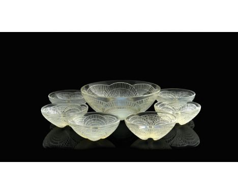 Rene Lalique, a Coquilles opalescent glass fruit set, model 3200 and 3204, designed circa 1924, including serving bowl and si