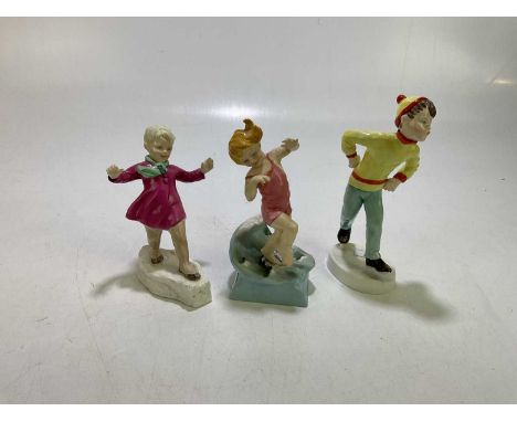 ROYAL WORCESTER; three ceramic figures comprising 'July', 'Tuesday's Child is Full of Grace' and 'January' (3).Condition Repo
