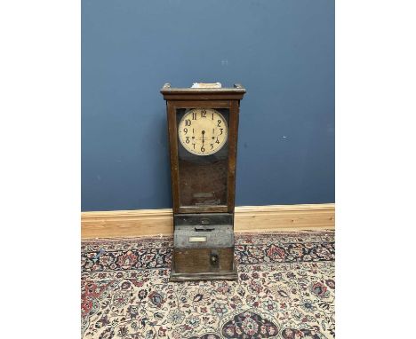 INTERNATIONAL TIME RECORDING COMPANY, LONDON; an oak cased clocking in clock, height 112cm.
