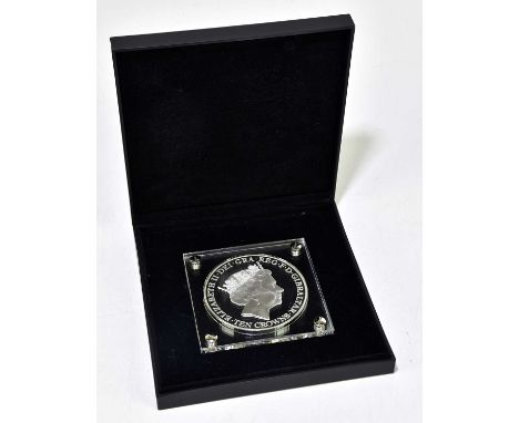 An Elizabeth II 2016 ten crowns silver 'coin', encased in perspex and in box.