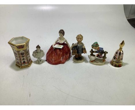 A small group of ceramics to include a Royal Crown Derby vase and bell, two German figures and two further figures.Condition 