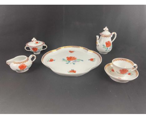 HEREND; a cased tea service in the Imari palette comprising a shaped tray, a lidded coffee pot, a lidded sugar bowl, a cream 